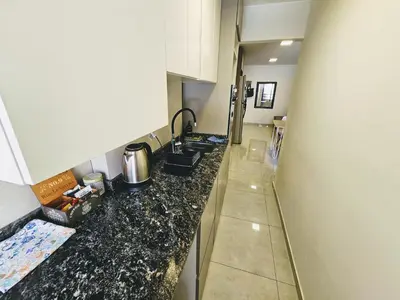 a kitchen with a sink and a counter top at Chic in Cordoba