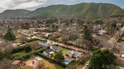 an aerial view of a town with mountains in the background at Cabañas Montecarlo 1 in Santa Rosa de Calamuchita