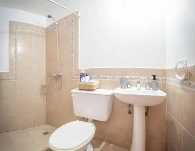 a bathroom with a toilet and a sink at Hermoso Departamento Planta Baja in Cordoba