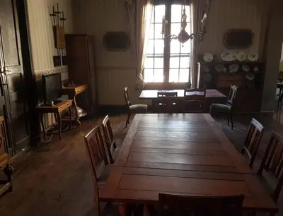 a large room with a large wooden table and chairs at Estancia Saldañil in Villa Los Aromos