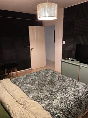 a bedroom with a large bed in a room at Hostel Nueva cordoba Subte Uno in Cordoba