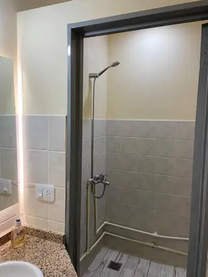 a bathroom with a shower and a sink at Hostel Nueva cordoba Subte Uno in Cordoba