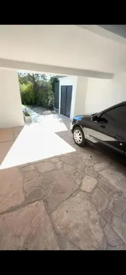 a car parked in a parking lot in a garage at Duplex 1 Dormitorio Costa Azul in Villa Carlos Paz