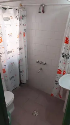 a bathroom with a shower with a toilet and a sink at Castillo Del Lago - Carlos Paz - D19 in Villa Carlos Paz