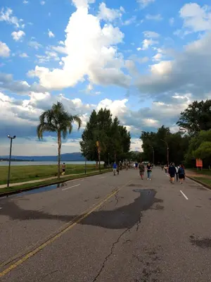 a group of people walking down a street at Castillo Del Lago - Carlos Paz - D19 in Villa Carlos Paz
