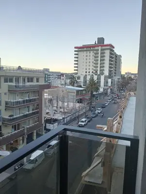 a view of a city street with buildings and cars at Depto Centrico Etoile 4 in Villa Carlos Paz