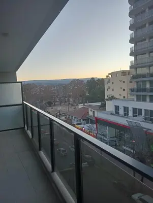 a balcony of a building with a view of a city at Depto Centrico Etoile 4 in Villa Carlos Paz