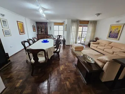 a living room with a table and a couch at Departamento Córdoba Semipiso frente a Patio Olmos in Cordoba