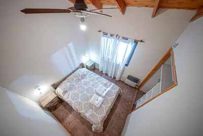an overhead view of a bedroom in a house at Cabañas Montecarlo 2 in Santa Rosa de Calamuchita