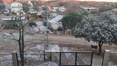 a view of a snowy street with a tree at Paz in Tanti