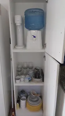 a cupboard filled with plates and bowls and dishes at Paz in Tanti