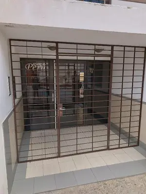 a cage with a dog inside of it at Departamento en zona Güemes in Cordoba