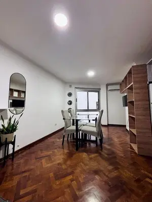 a dining room with a table and chairs at Departamento Frente Campus UNC in Cordoba