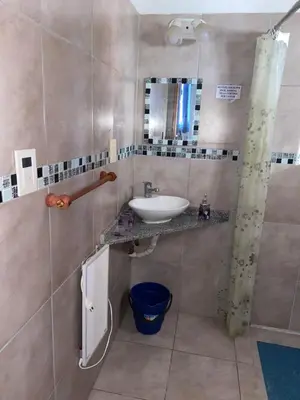 a bathroom with a sink and a mirror at La loreta in Mina Clavero