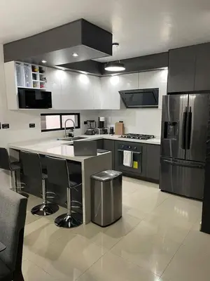 a large kitchen with a island in the middle at Villa serrana in Mina Clavero