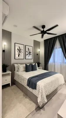 a bedroom with a large bed with a ceiling fan at Villa serrana in Mina Clavero