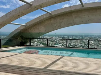 a swimming pool on top of a building at Rent a flat - Alto Paz Tower in Cordoba
