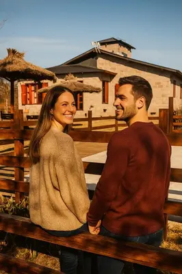 a man and a woman sitting on a bench at El Alma De Yacanto Hotel Boutique in Villa Yacanto