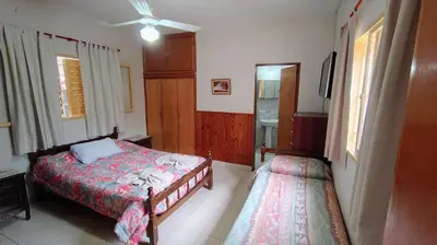 a small bedroom with a bed and a window at Dpto Marina in Villa Cura Brochero