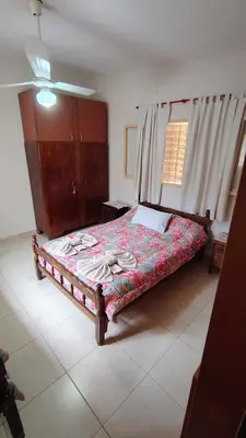 a bedroom with a bed in a room with a window at Dpto Marina in Villa Cura Brochero