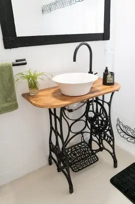 a bathroom vanity with a bowl sink on a table at Aires del Casco in La Porteña