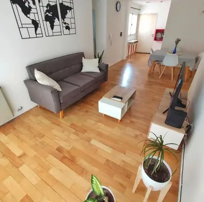 a living room with a couch and a table at Departamento en calle Independencia in Cordoba