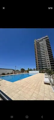 a large building with a swimming pool in front of a building at Terra Zión in Cordoba