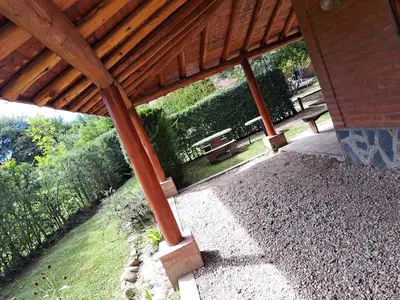 an overhead view of a patio under a wooden roof at complejo inti sumah in Nono