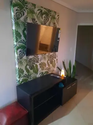 a living room with a mirror and a dresser at Terra Zión in Cordoba
