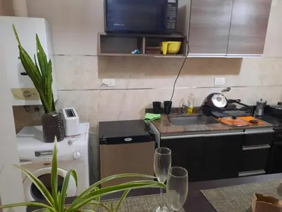 a small kitchen with a sink and a counter at Terra Zión in Cordoba