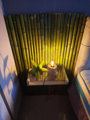 a room with a table with a candle and a plant at Terra Zión in Cordoba