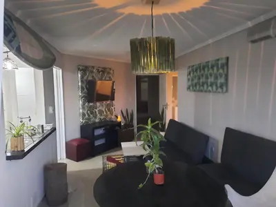 a living room with a couch and a table at Terra Zión in Cordoba