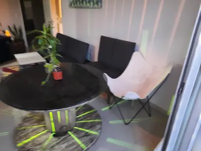 a table and chairs in a living room at Terra Zión in Cordoba