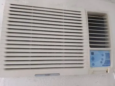 a vent on a white wall with a window at Departamento luna in Cordoba