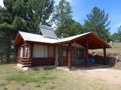 a small cabin with a solar panel on top of it at Cabañas Alma de Montaña