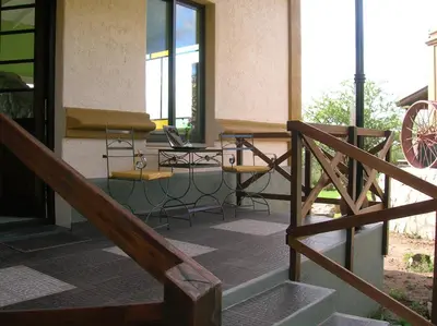 a balcony with a table and a laptop on it at Apart Los Antiguos in Merlo