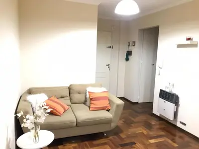 a living room with a couch and a table at Pueyrredon045 in Cordoba