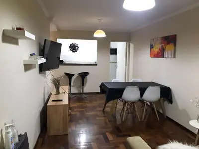a living room with a dining room table and chairs at Pueyrredon045 in Cordoba