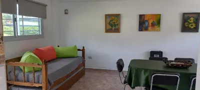 a room with a bed and a table with a green table cloth at Mafalda in Tanti