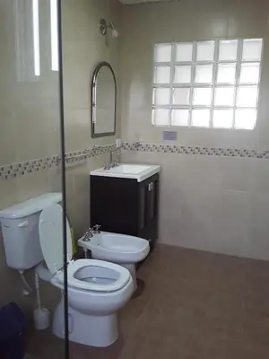 a bathroom with a toilet and a sink and a mirror at Mafalda in Tanti