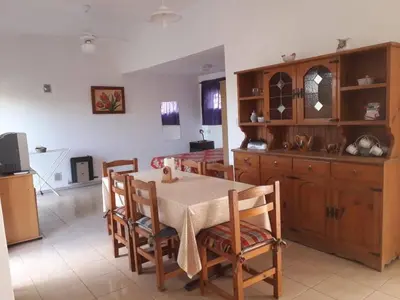 a kitchen and dining room with a table and chairs at Mafalda in Tanti