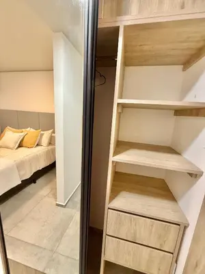 a small room with a bed in the background at Petit Premium Nueva Cba - Oulton in Cordoba