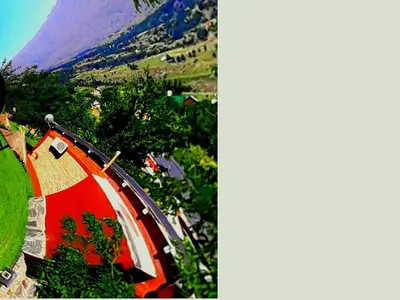 a colorful umbrella sitting on top of a hill at Puesto Potrillos in Villa Yacanto
