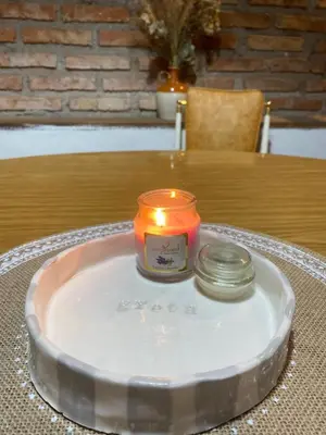 a candle sitting on top of a table at La casa de Pedro in San Roque