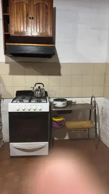 a kitchen with a stove and a sink at La casa de Pedro in San Roque