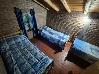 an aerial view of a bedroom with two beds at Cabañas Eduviges in Mina Clavero