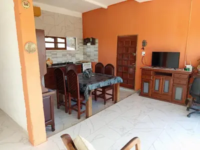 a dining room with a table with chairs and a tv at CABAÑA Casa Saavedra in Tanti