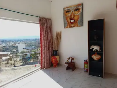 a room with a window with a mask on the wall at CABAÑA Casa Saavedra in Tanti