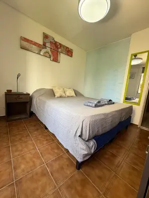 a bedroom with a bed in a room at Apartmento completo en Nueva Córdoba Argentina in Cordoba