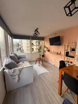 a living room with a couch and a table at Apartmento completo en Nueva Córdoba Argentina in Cordoba